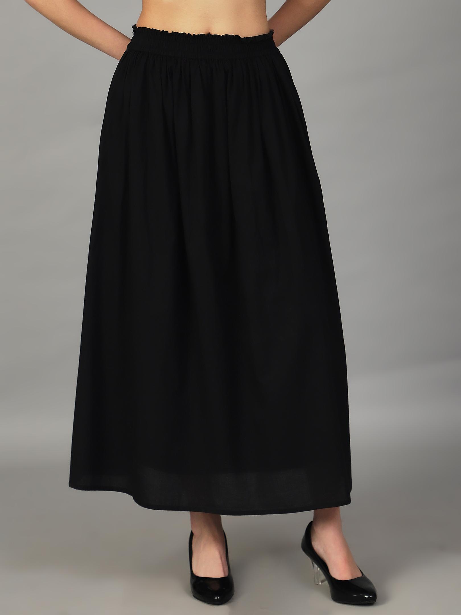 Black skirt worn by a model on a gray background