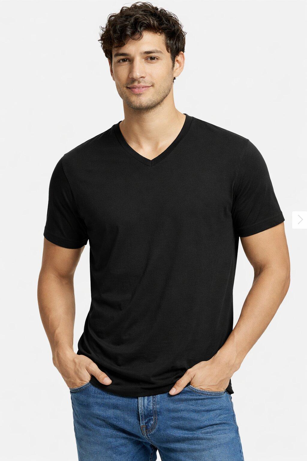 Man wearing a black cotton V-neck t-shirt and blue jeans on a white background