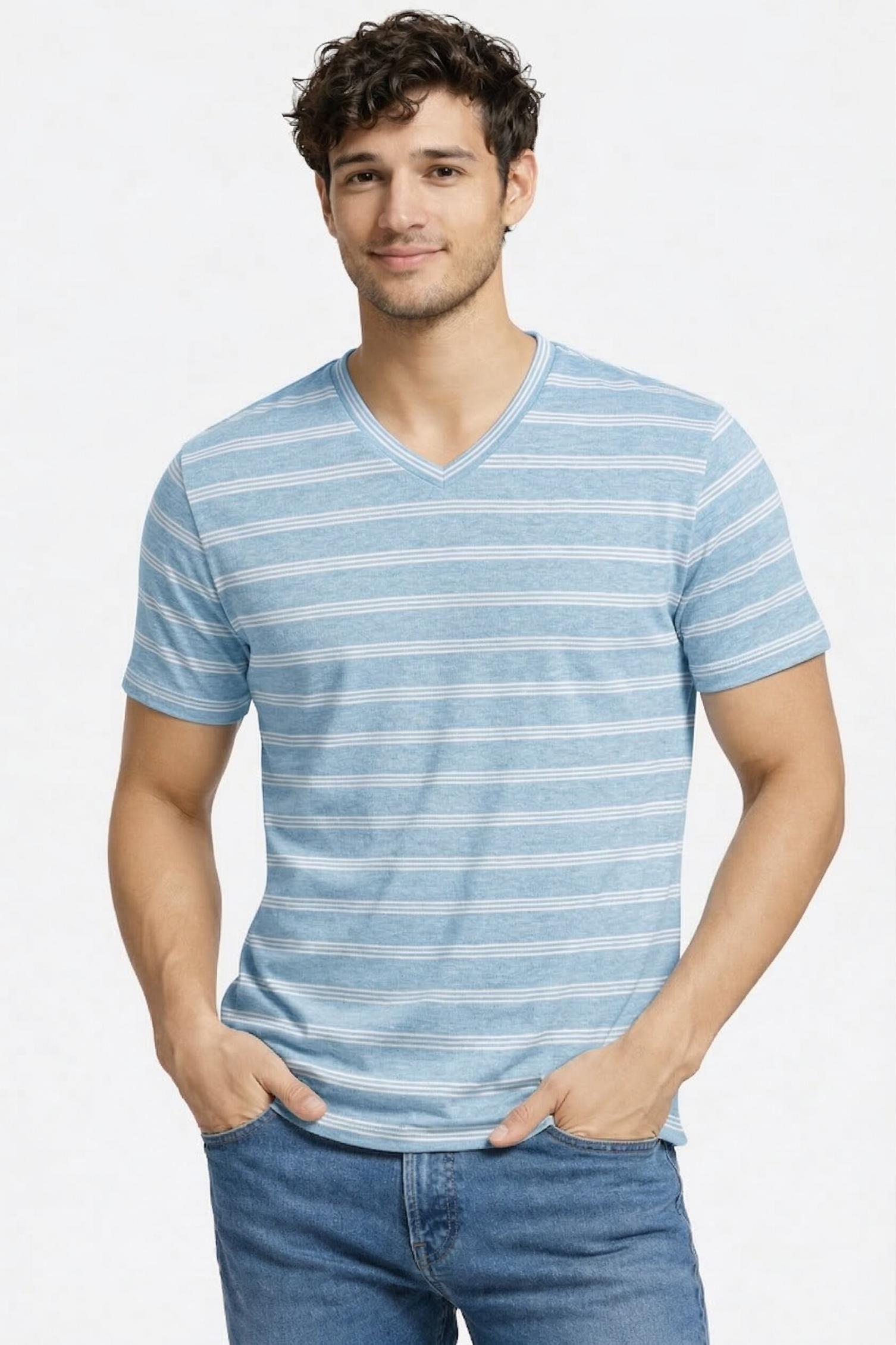 Man wearing a blue striped shirt and jeans on a light gray background